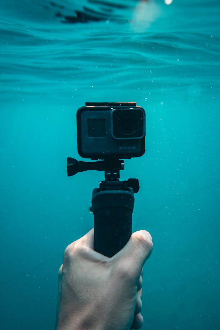 Services-01 A hand holding an action camera underwater in Jezerane, Croatia.